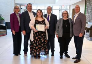 LFS staff pose for a photo with the Family-friendly Workplace award.