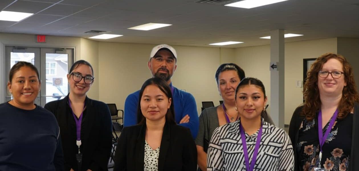 The Lexington LFS staff gather for a photo inside the Lexington office.
