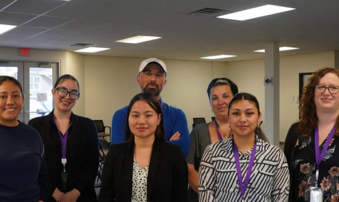 The Lexington LFS staff gather for a photo inside the Lexington office.