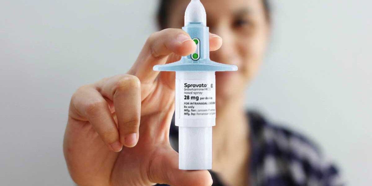 A woman holds the Spravato nasal spray treatment.