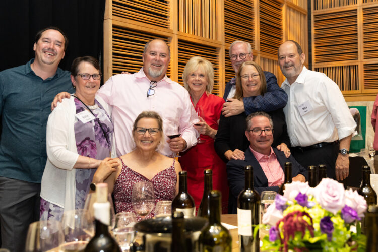 Vitner's Dinner attendees Attendees at the LFS Vitner's diner pose in front of a table of wine.